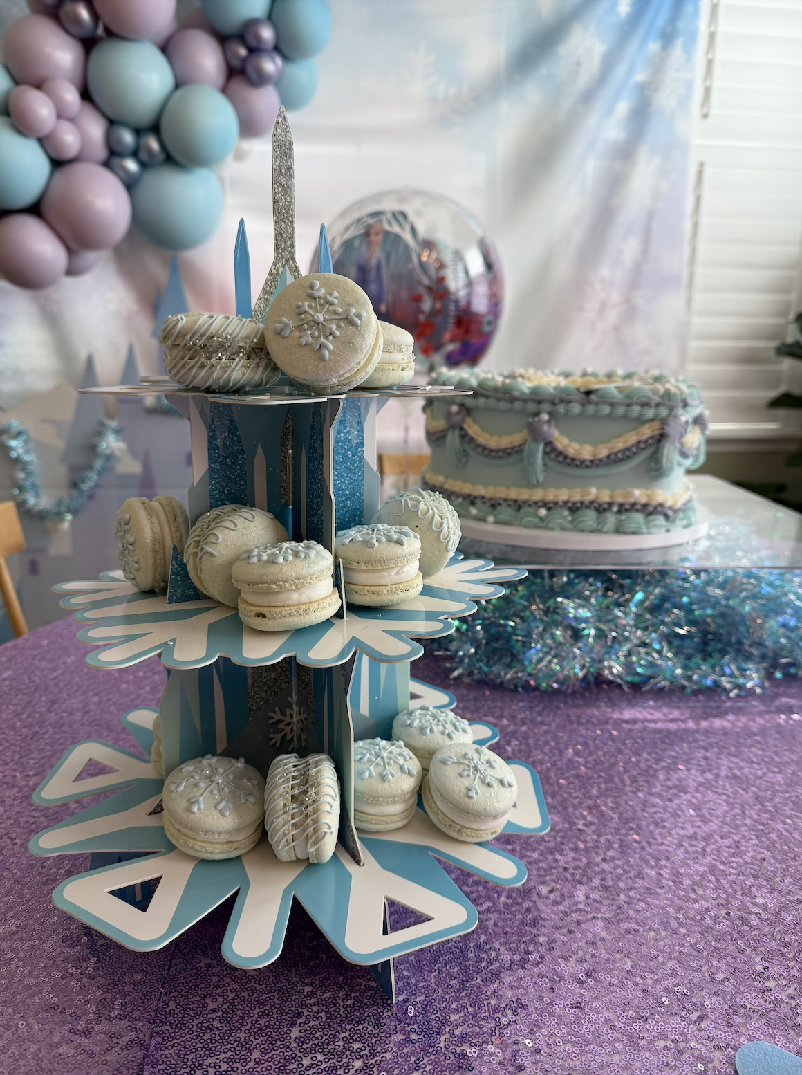 Snowflake-themed macarons and cake